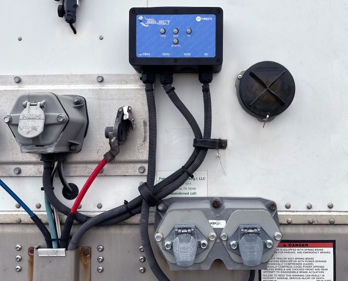 Dual charging system on the side of a Liftgate trailer